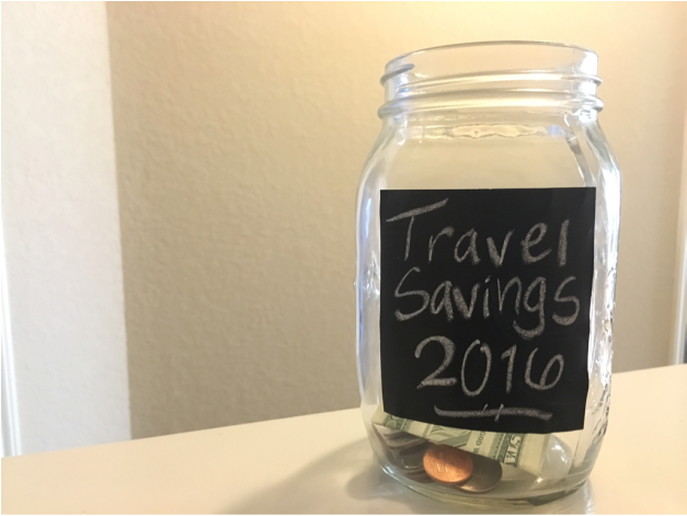 Mason jar filled with coins for saving