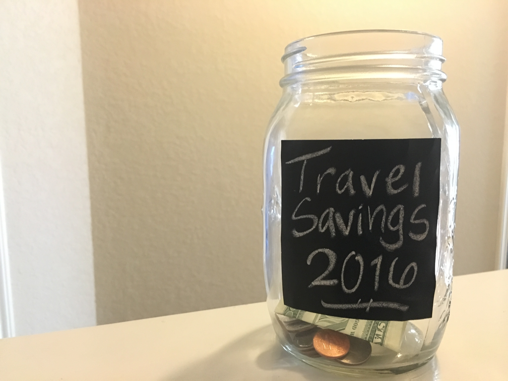 Mason jar filled with some money for savings.